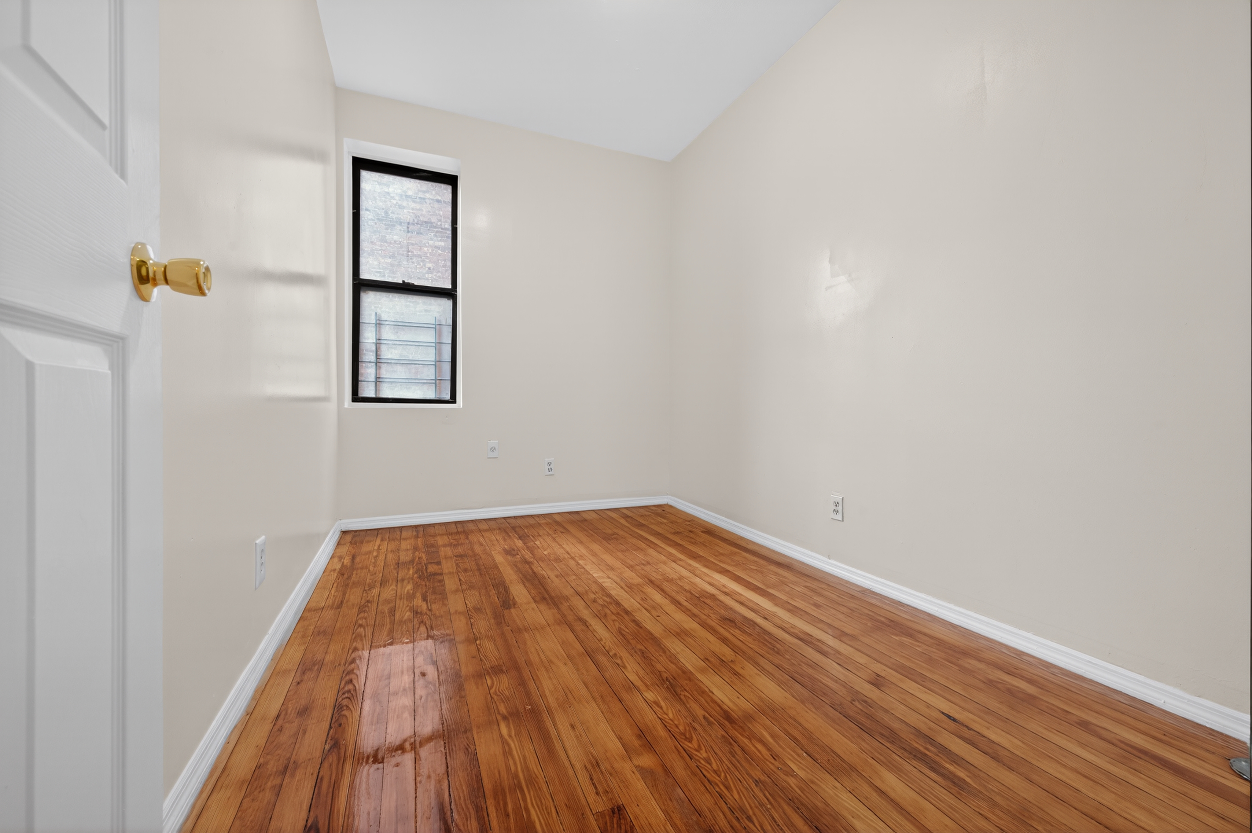 Living space with high ceilings and hardwood floors
